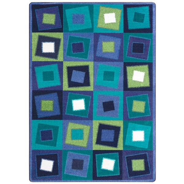 A close-up of a Joy Carpets rectangular area rug with squares in blue, green and white.