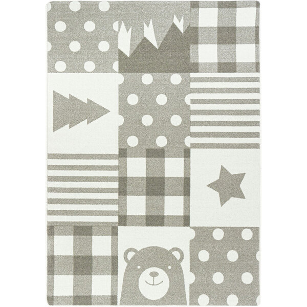 A Joy Carpets Claremont Kids Patchwork Boy area rug with bear and star patterns.