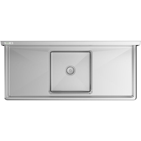 A Regency stainless steel sink with 2 drainboards and a drain.