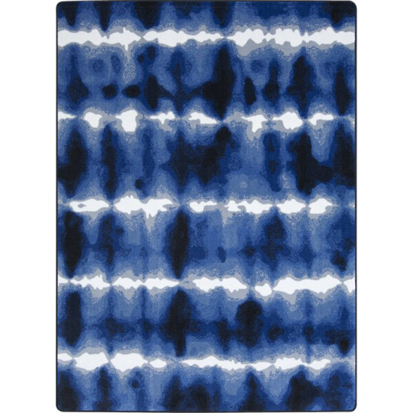A close-up of a blue and white rug with a pattern.