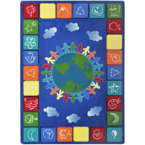 A blue rug with colorful squares and a globe with people around the earth.