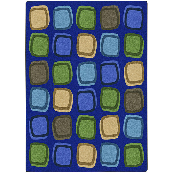 A white area rug with blue squares in different colors.