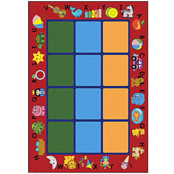 A red Joy Carpets area rug with colorful letters and numbers in different colored squares.