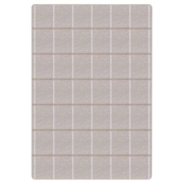 An ivory rectangular area rug with squares on it.