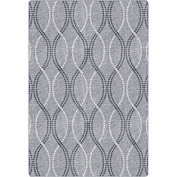 A close-up of a grey and white patterned rug.