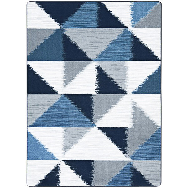 A close up of a Joy Carpets rectangular area rug with blue and grey triangles.