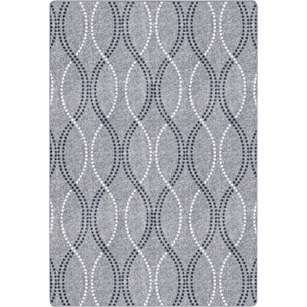 A close-up of a Joy Carpets Seventh Heaven smoke grey rectangular area rug with a grey and white pattern.
