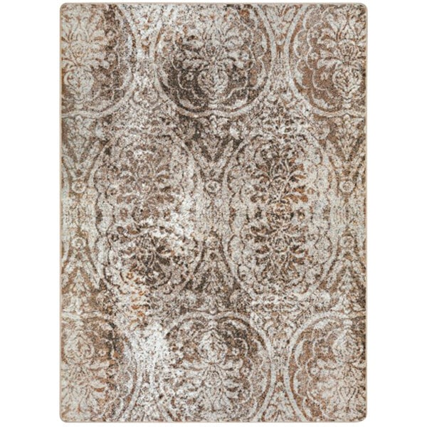 A close-up of a Joy Carpets First Take Antique Taupe area rug with an ornate pattern in beige and brown.