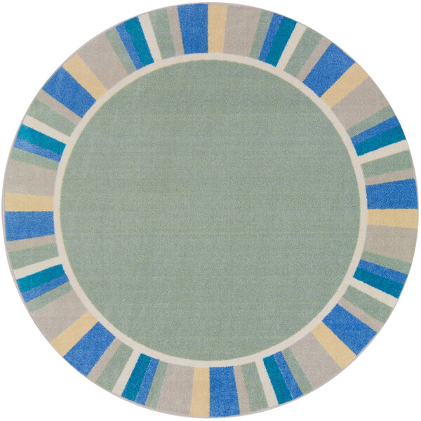 A round sage green rug with blue and yellow stripes.