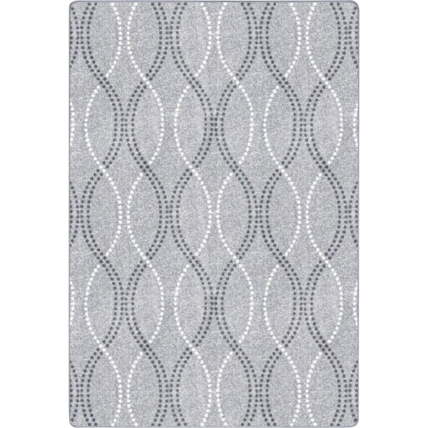 A close up of a gray Joy Carpets area rug with a white pattern.