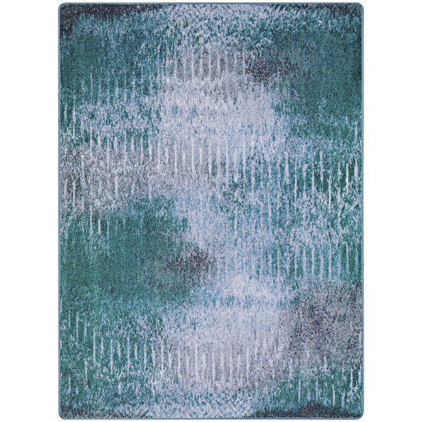 A close-up of a blue and green Joy Carpets area rug with a pattern of mirage lake.