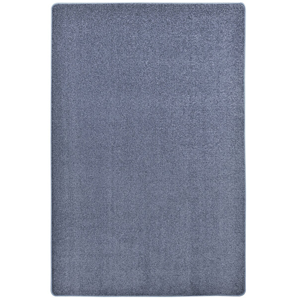 A close-up of a Joy Carpets Kid Essentials Endurance rectangle area rug in gray with a square pattern.