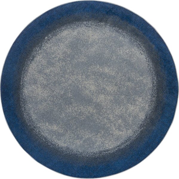 A round blue and grey rug with a white background.