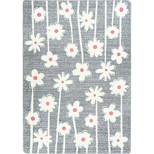 A white area rug with grey and pink flowers.