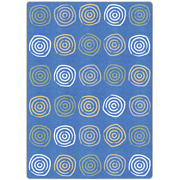 A pastel blue rectangular area rug with white and orange swirls and circles.