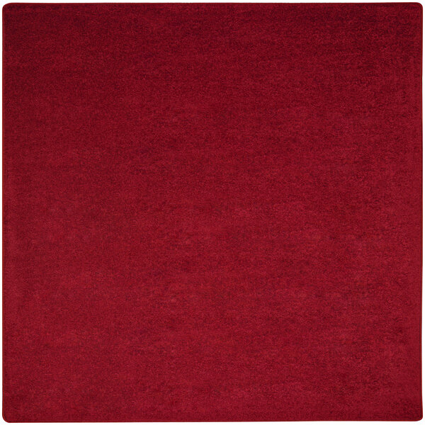 A red square rug with a white border.