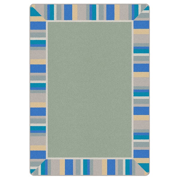 A Joy Carpets rectangular area rug with a white background and blue, green, and yellow border.