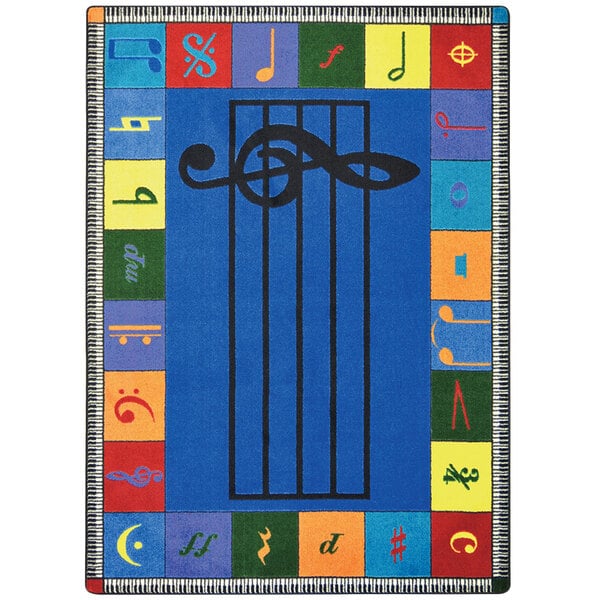 A multicolored Joy Carpets area rug with musical symbols including a treble clef and notes.