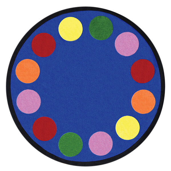 A Joy Carpets round area rug with colorful circles on a blue background.