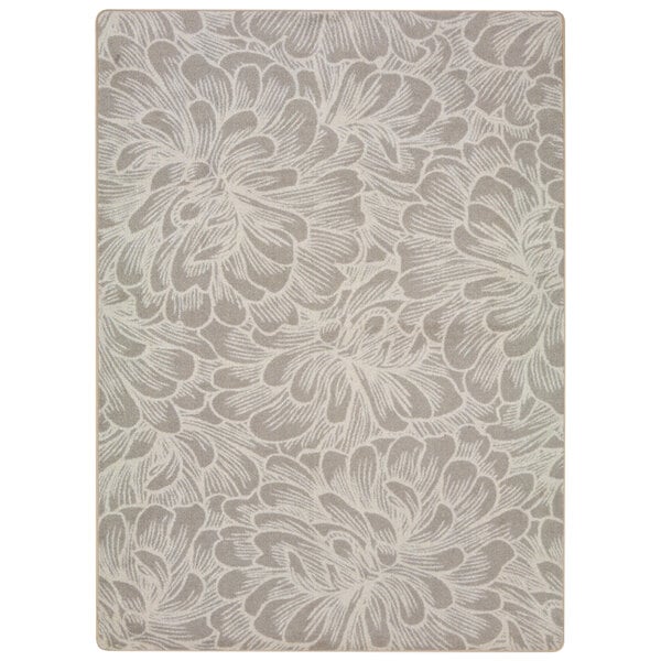 A Joy Carpets rectangular area rug in white and grey with a floral pattern.