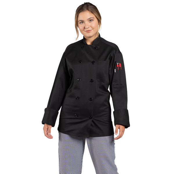 A woman wearing a black Uncommon Chef long sleeve chef coat with a mesh back.