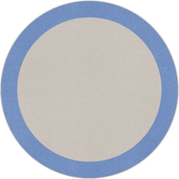 A blue and white round rug with a white border.