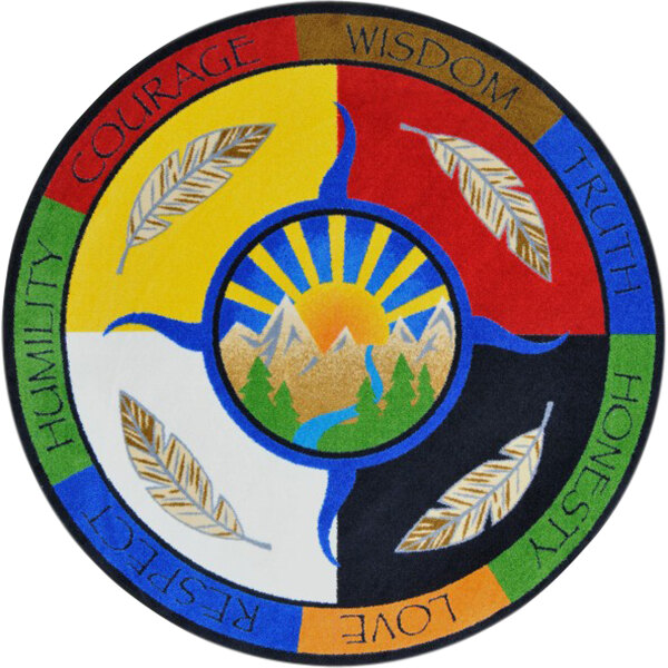 A multicolored circular rug with the words peace, wisdom, and love in a sun design.