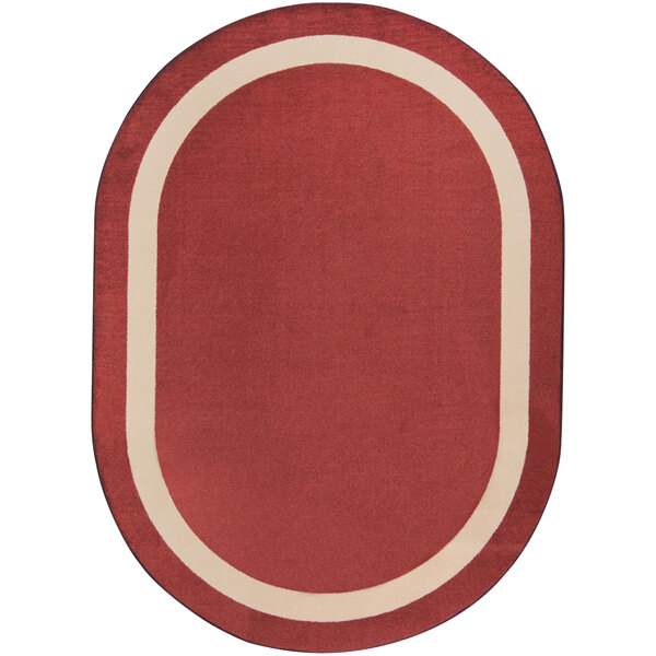 An oval wine red rug with a white border.