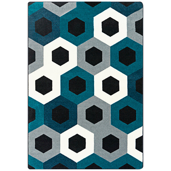 A blue rug with hexagons in blue and black.