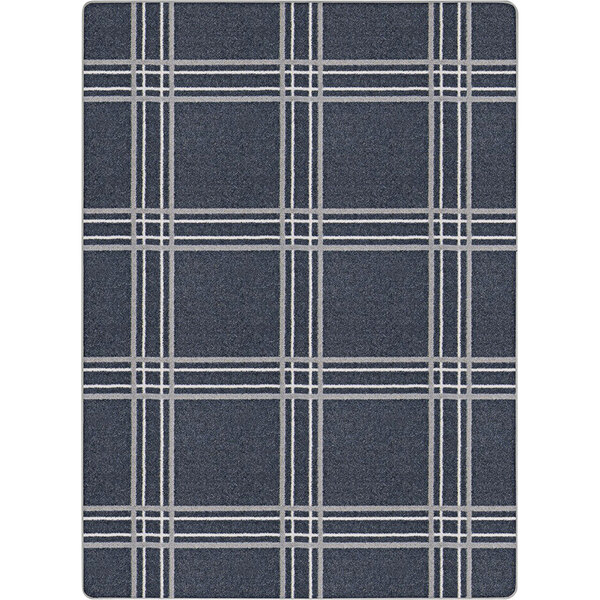 A close-up of a blue and white plaid Joy Carpets area rug.