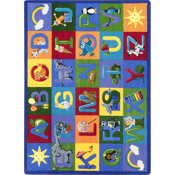 A white area rug with colorful letters and animals.