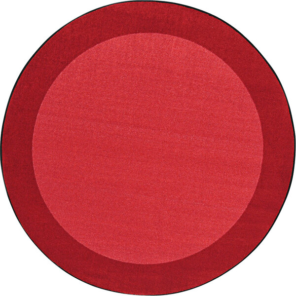 A red circle rug with a black border.