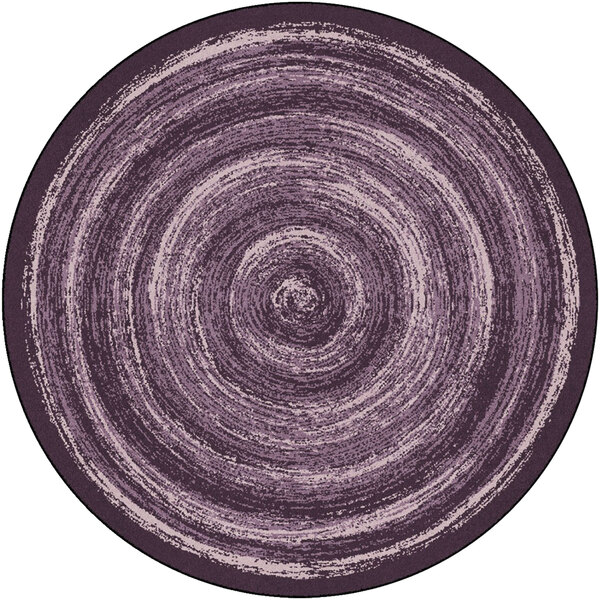 A purple circular Joy Carpets area rug with a spiral pattern.
