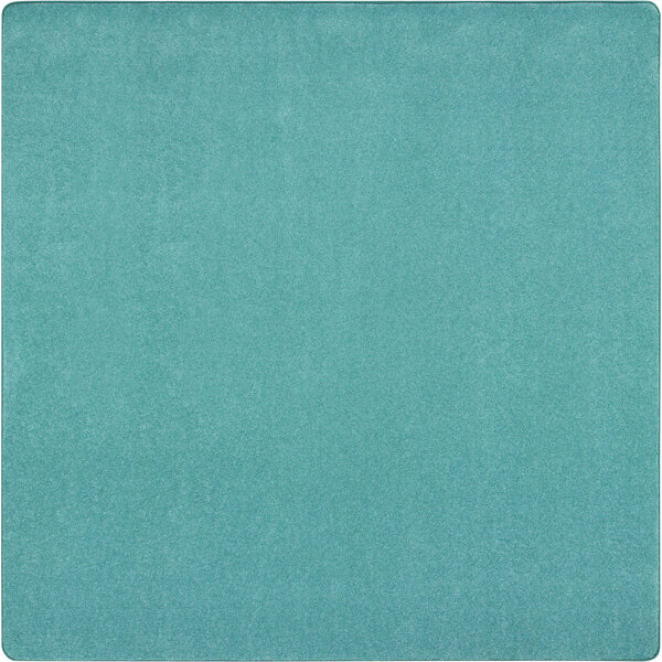 A Joy Carpets seafoam square area rug with a turquoise blue square design.