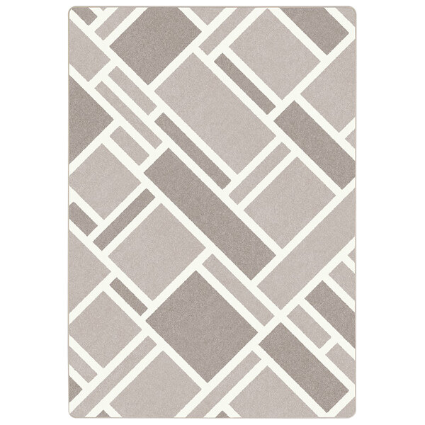 A close up of the gray and white geometric pattern on a Joy Carpets Impressions Midas rectangular area rug.