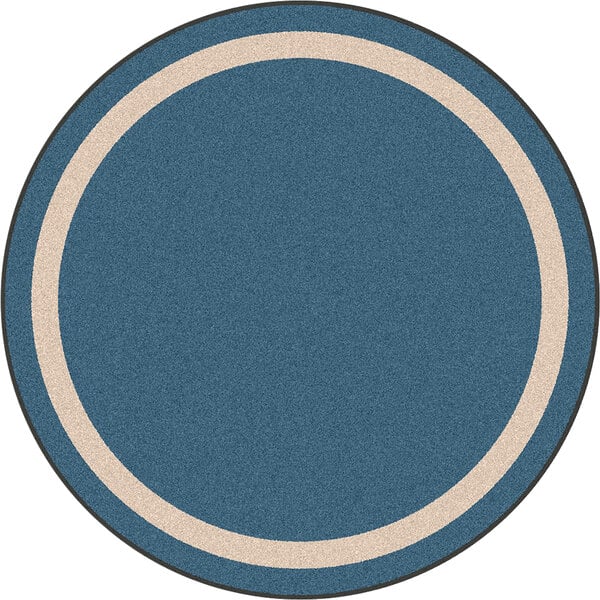 A white round area rug with a blue circle and white border.