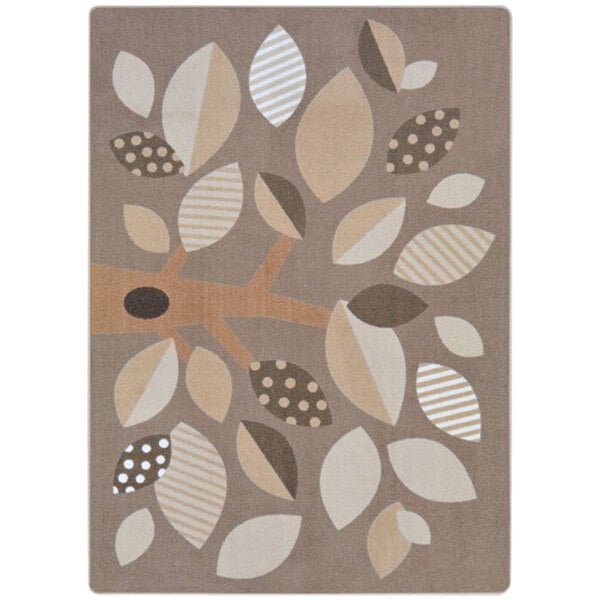 A brown and beige rectangular area rug with leaves and dots.