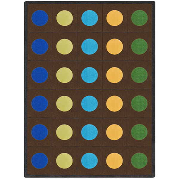 A brown rectangular area rug with blue circles on it.