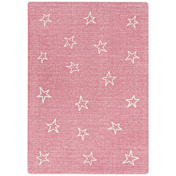 A blush rectangular area rug with white stars on it.