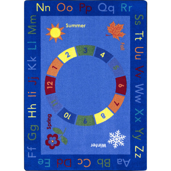 A multi-colored rectangle area rug with letters and numbers in colorful circles.