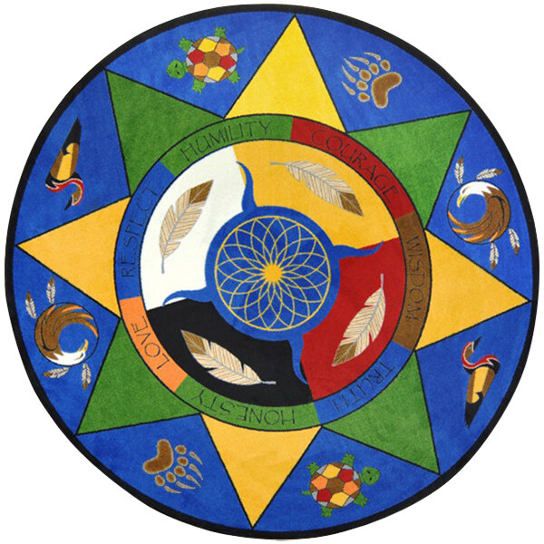 A Joy Carpets multicolored round area rug with different symbols on it.