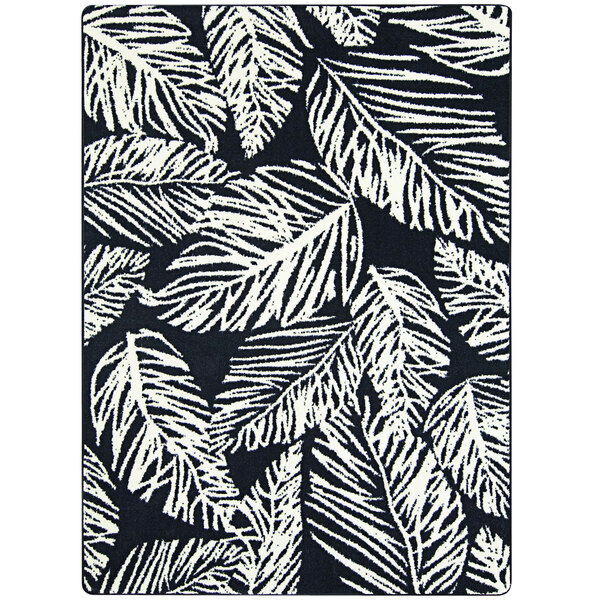 A close-up of a Joy Carpets black and white rug with white leaves.