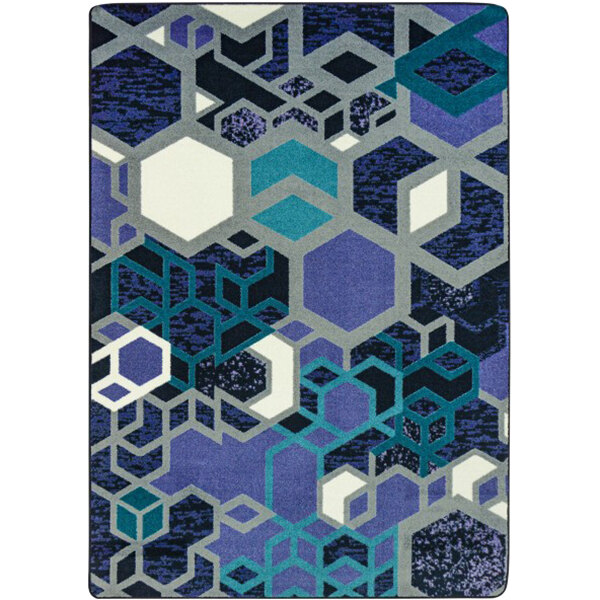 A violet rectangular area rug with blue and white hexagons, blue and white squares, and blue and green diamonds.