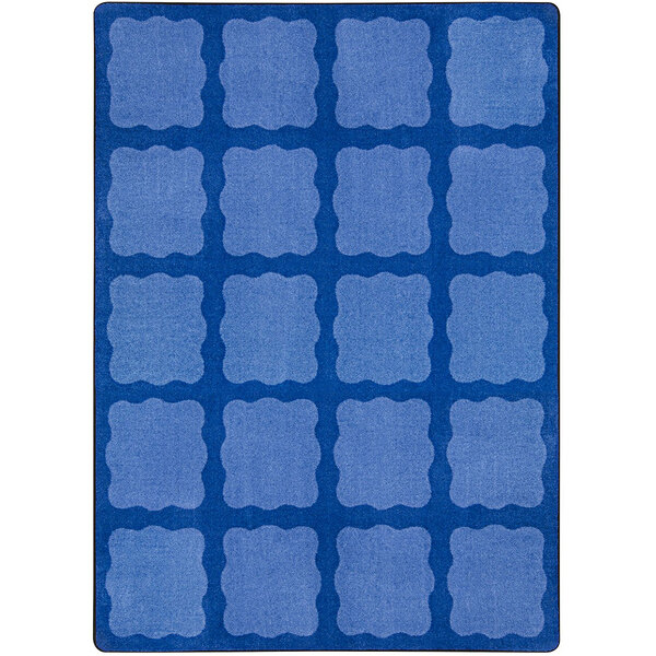 A multicolored rectangular area rug with blue squares on it.