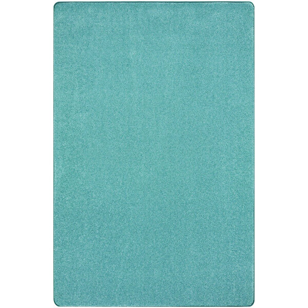 A seafoam rug with a white background.