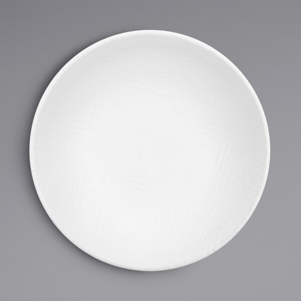A Cal-Mil Sedona white melamine bowl with a textured rim.