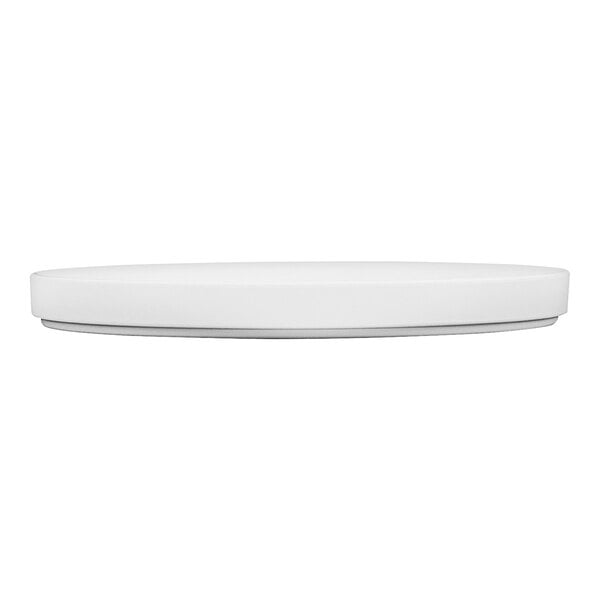 A white Cal-Mil low rim melamine plate with a circular design.