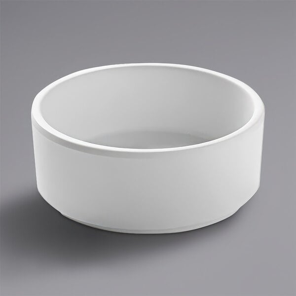 A close up of a white Cal-Mil stackable ramekin.