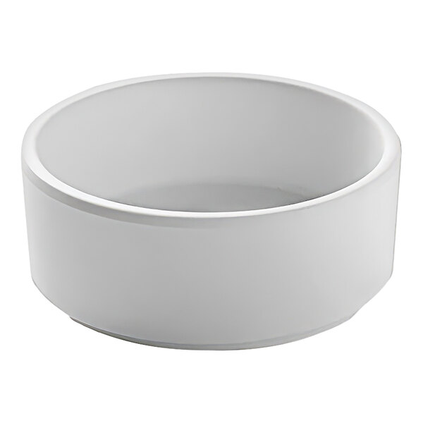 A white Cal-Mil stackable ramekin with a white rim.