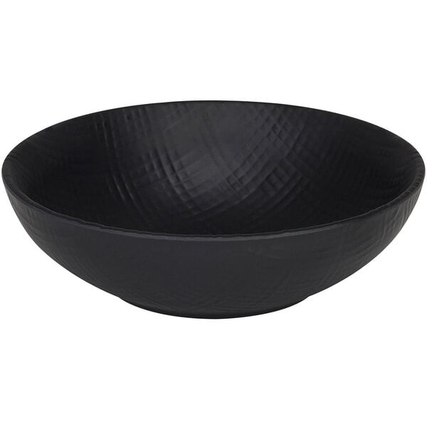 A black Cal-Mil Sedona coupe melamine bowl with a textured surface.